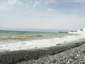 Scenic view of beach against sky