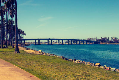 Bridge over sea against sky