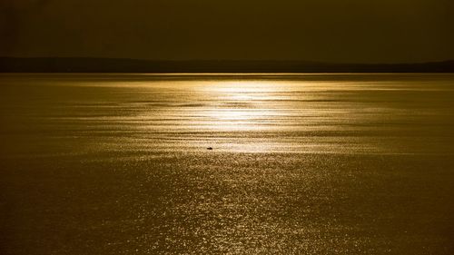 Scenic view of sea against sky at night