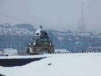 Barry town hall clock tower and barry island during snow from rooftop level