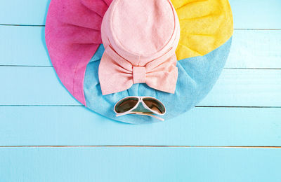 High angle view of hat and sunglasses on table