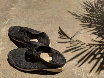 High angle view of shoes on sand