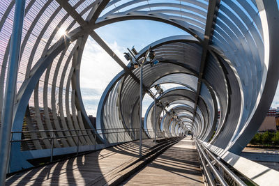 View of footbridge against sky