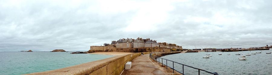 View of bridge against cloudy sky