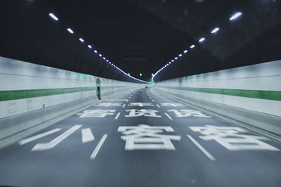 High speed view inside illuminated tunnel near chongming island