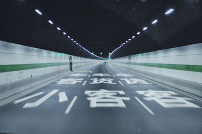 High speed view inside illuminated tunnel near chongming island