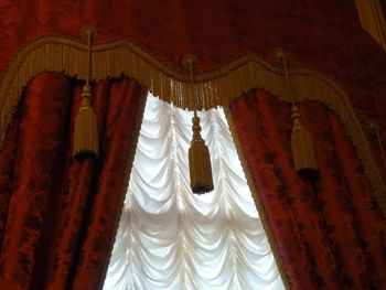 Low angle view of cross hanging in temple