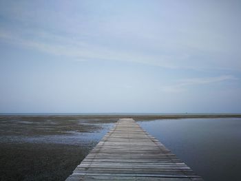 Pier over sea against sky