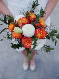 Close-up of hand holding flower bouquet