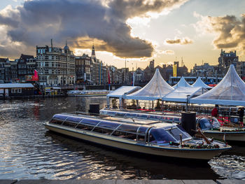 Boats moored at harbor