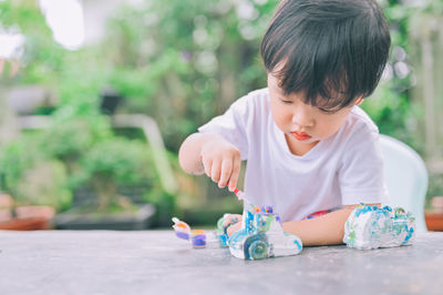 Cute boy playing with toy