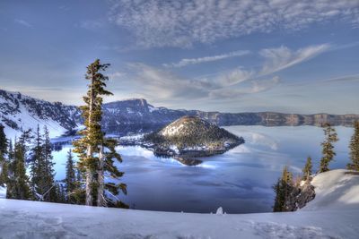 Scenic view of snow covered mountains against sky