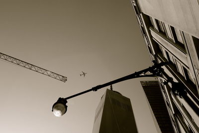 Low angle view of communications tower against sky