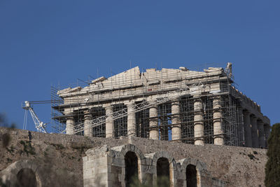 Low angle view of historical building against blue sky