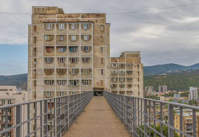 View of buildings against cloudy sky