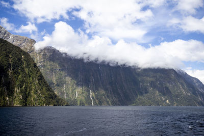 Scenic view of mountains and sea against sky