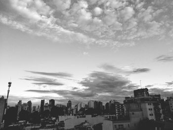 Buildings in city against sky