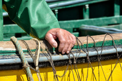 Close-up of man working in water