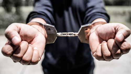 Close-up of man holding hands