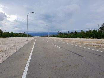 Empty road against sky