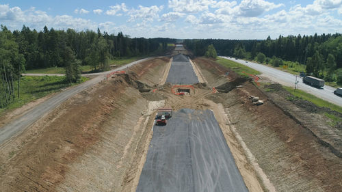 Construction of toll roads in rural areas. construction of a new highway next to the old highway.