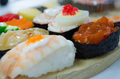 Close-up of sushi on serving board