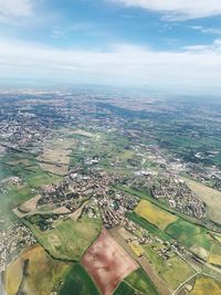 Aerial view of agricultural field against sky