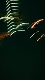 Low angle view of illuminated lights at night