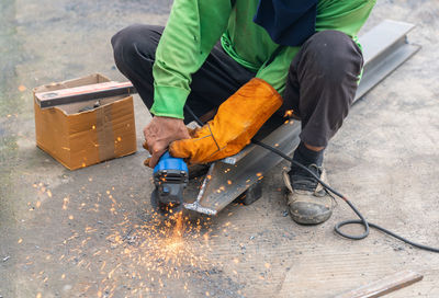 Low section of man working at workshop