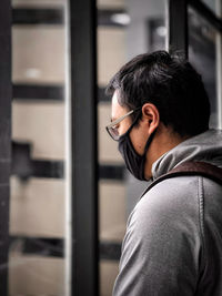 Portrait of young man standing outdoors