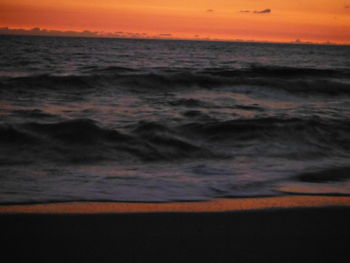 Scenic view of sea against sky at sunset