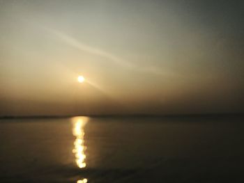 Scenic view of sea against sky at sunset