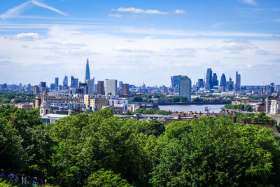 View of modern buildings in city against sky