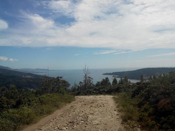 Scenic view of sea against cloudy sky