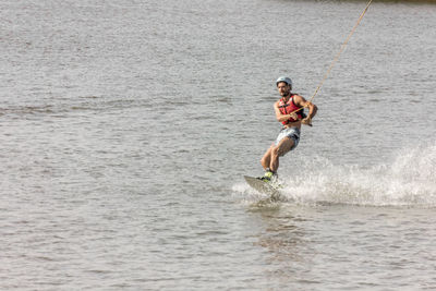 Full length of a man jumping in sea