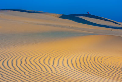 Scenic view of desert against clear sky