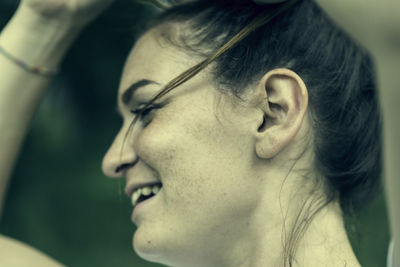 Close-up portrait of smiling mid adult woman