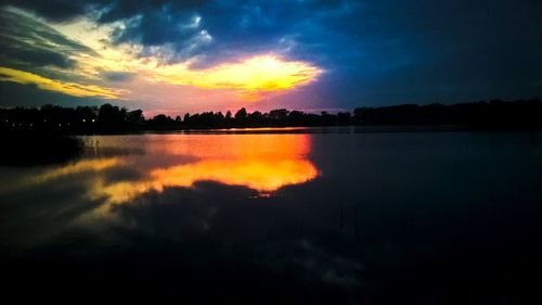 Scenic view of lake at sunset