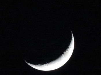 Low angle view of moon against sky at night