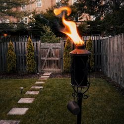 Woman with fire hydrant against trees