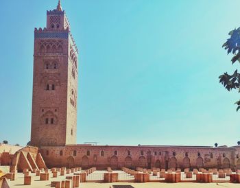 Low angle view of historic building against clear blue sky