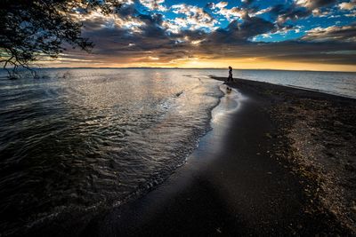 Scenic view of sea at sunset