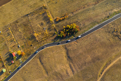 Aerial view of road amidst field