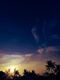 Low angle view of silhouette trees against sky during sunset