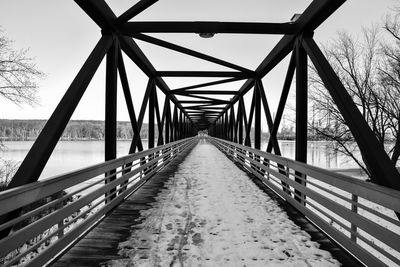 Footbridge over snow covered land