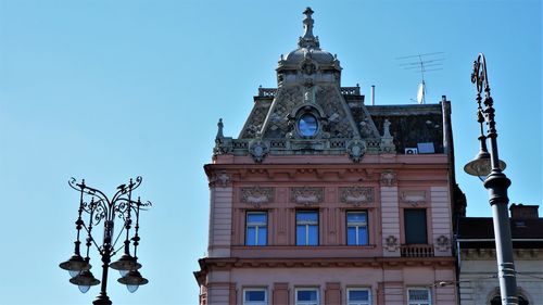 Low angle view of building against blue sky