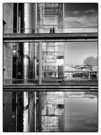 Reflection of buildings in puddle