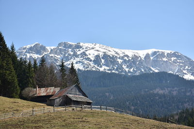 Scenic view of snowcapped mountains against clear sky