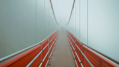 View of suspension bridge in foggy weather