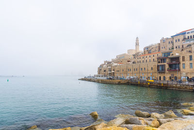 Old jaffa port and tel-aviv in fog time